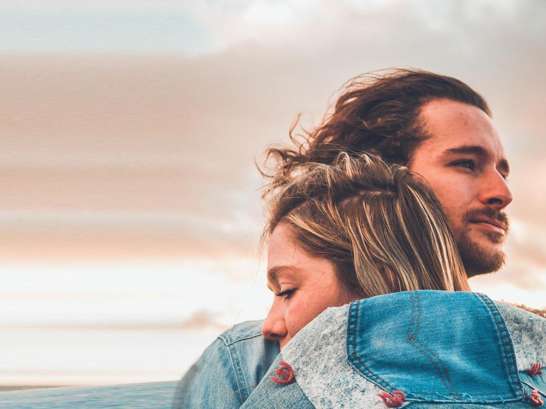 man-holding-women-sky-background-tablet
